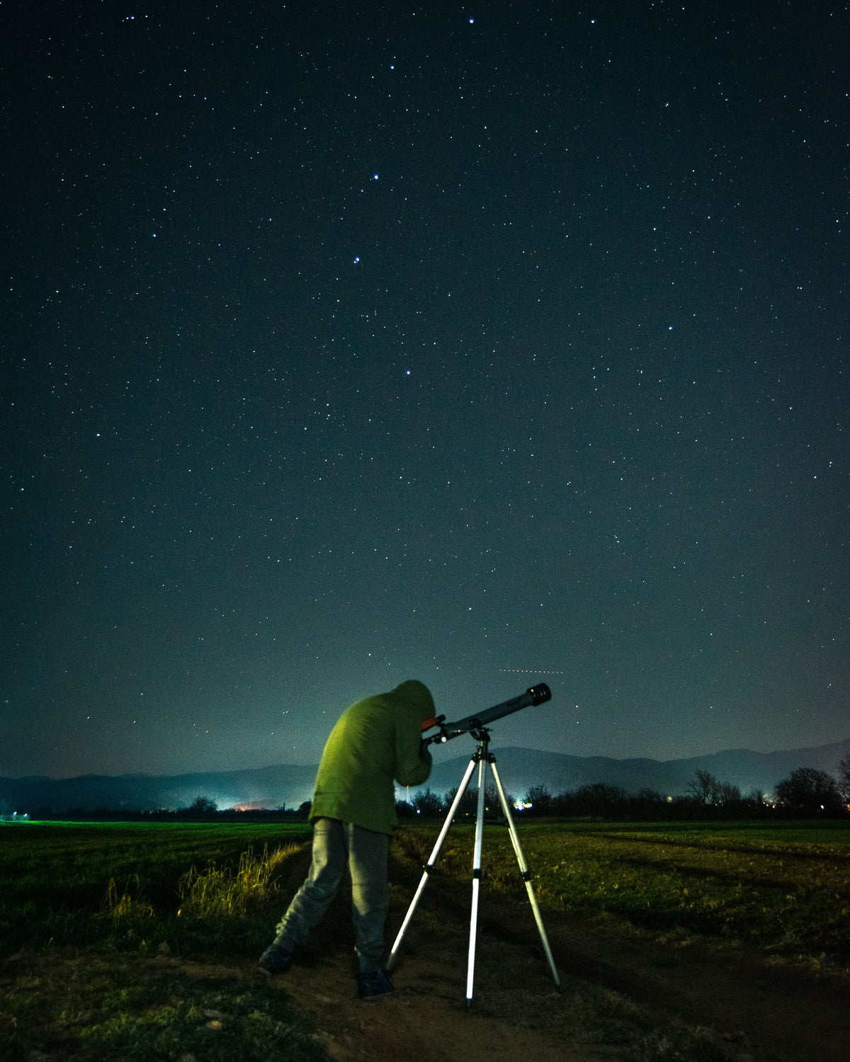 Spotting scope on a tripod at night